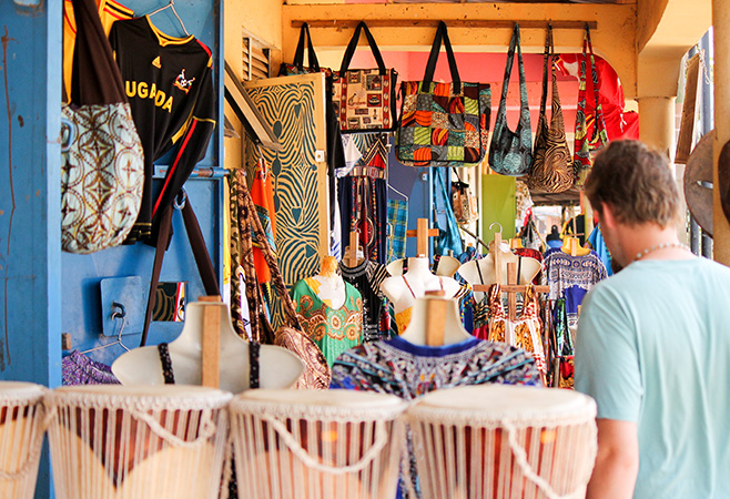 A male tourist shopping for african souvenirs Kampala, Uganda