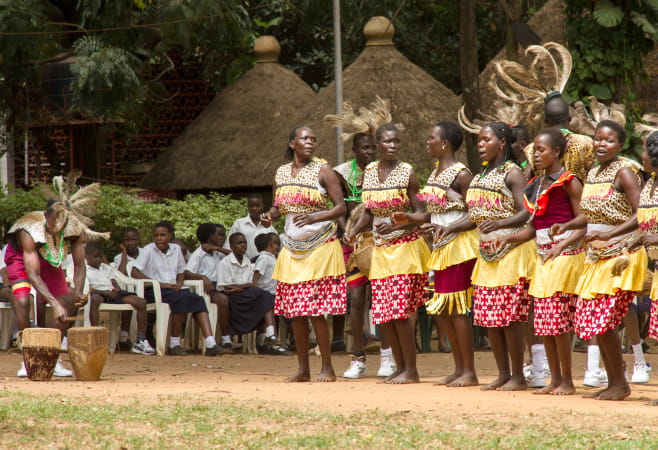 A group performs a song and dance outside the Kampala National Theatre in Kampala, Uganda