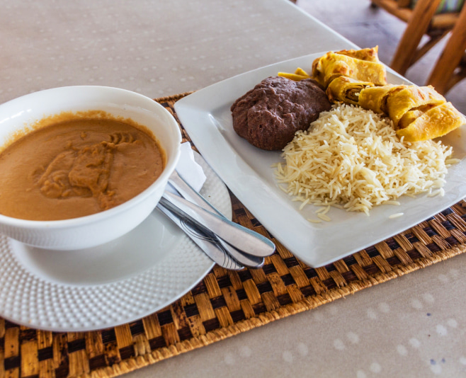 Meal in Uganda - groundnut (peanut) sauce, rice, chapati and posho corn meal