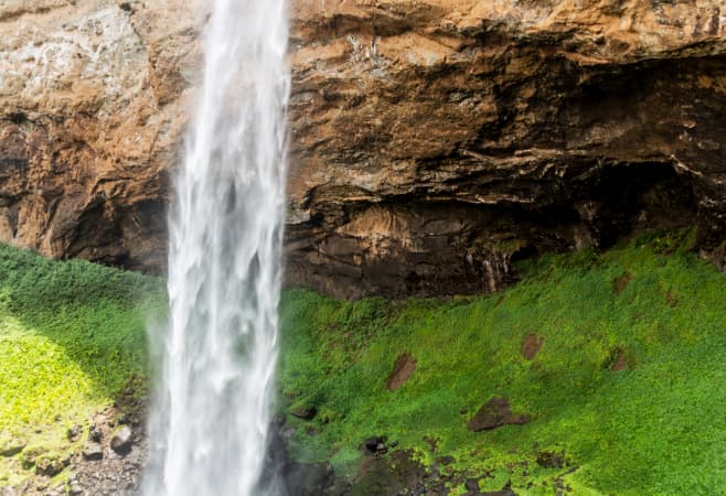 Travelers enjoying the hike to the upper Sipi waterfall – a perfect spot for nature lovers