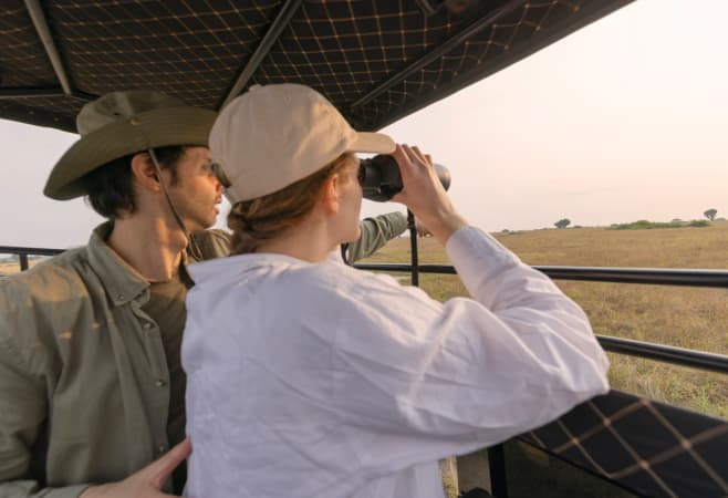 Tourists observe wildlife in the National Park