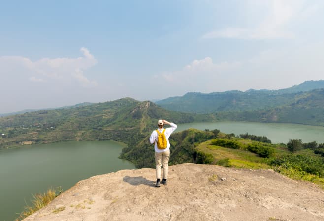 Young tourist looking for the twin lakes of Katinda and Mirambi, Uganda